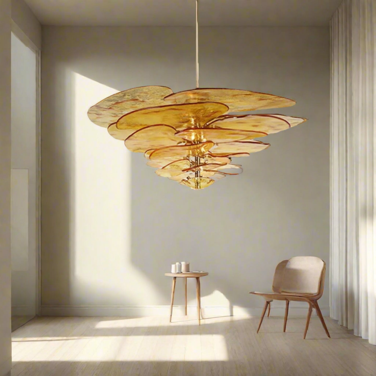 Modern chandelier in a stylish interior setting with a sculpture on a pedestal.
