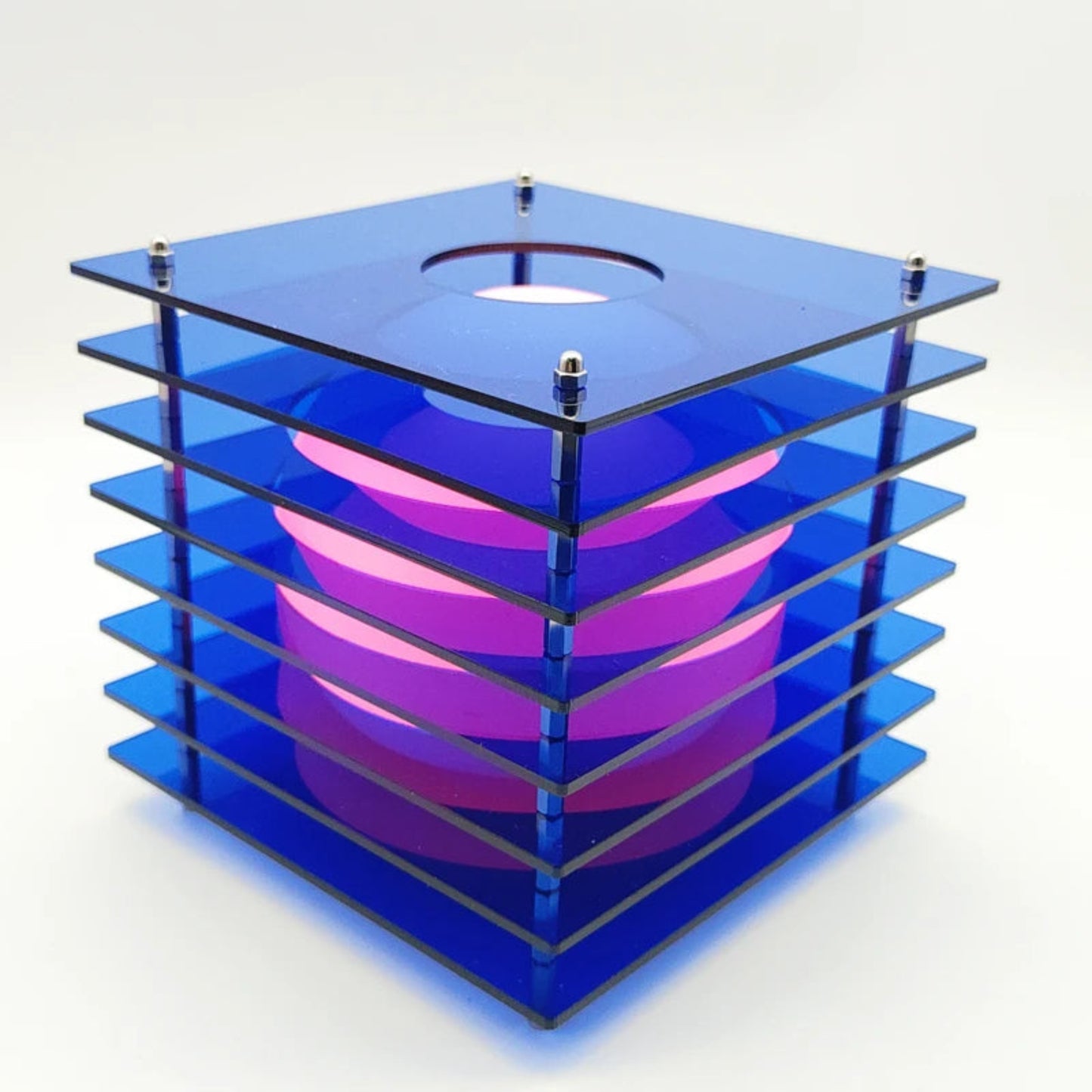 Blue and pink geometric candle holder on a white background