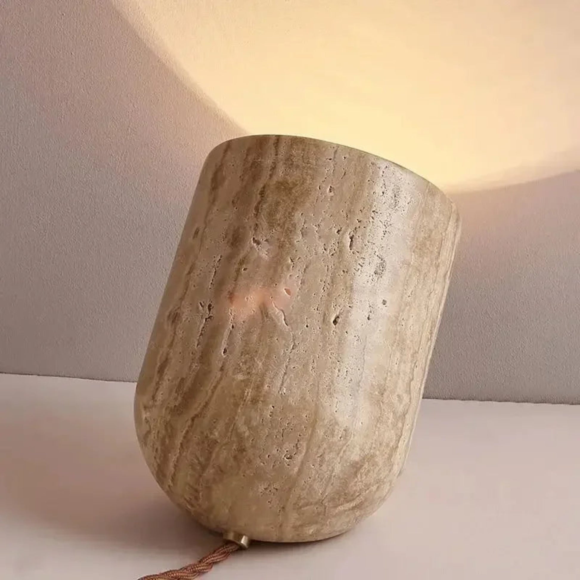 Ceramic lamp with a textured surface on a neutral background
