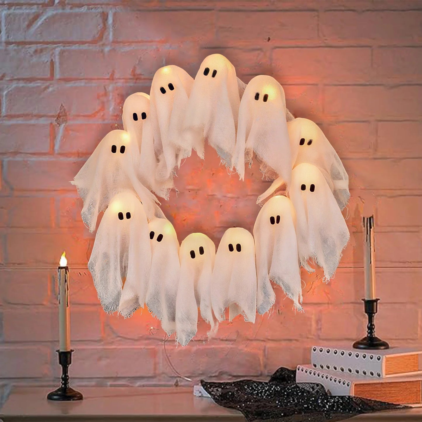 Halloween ghost decorations on a brick wall background