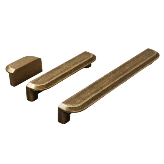 Three bronze cabinet handles on a white background
