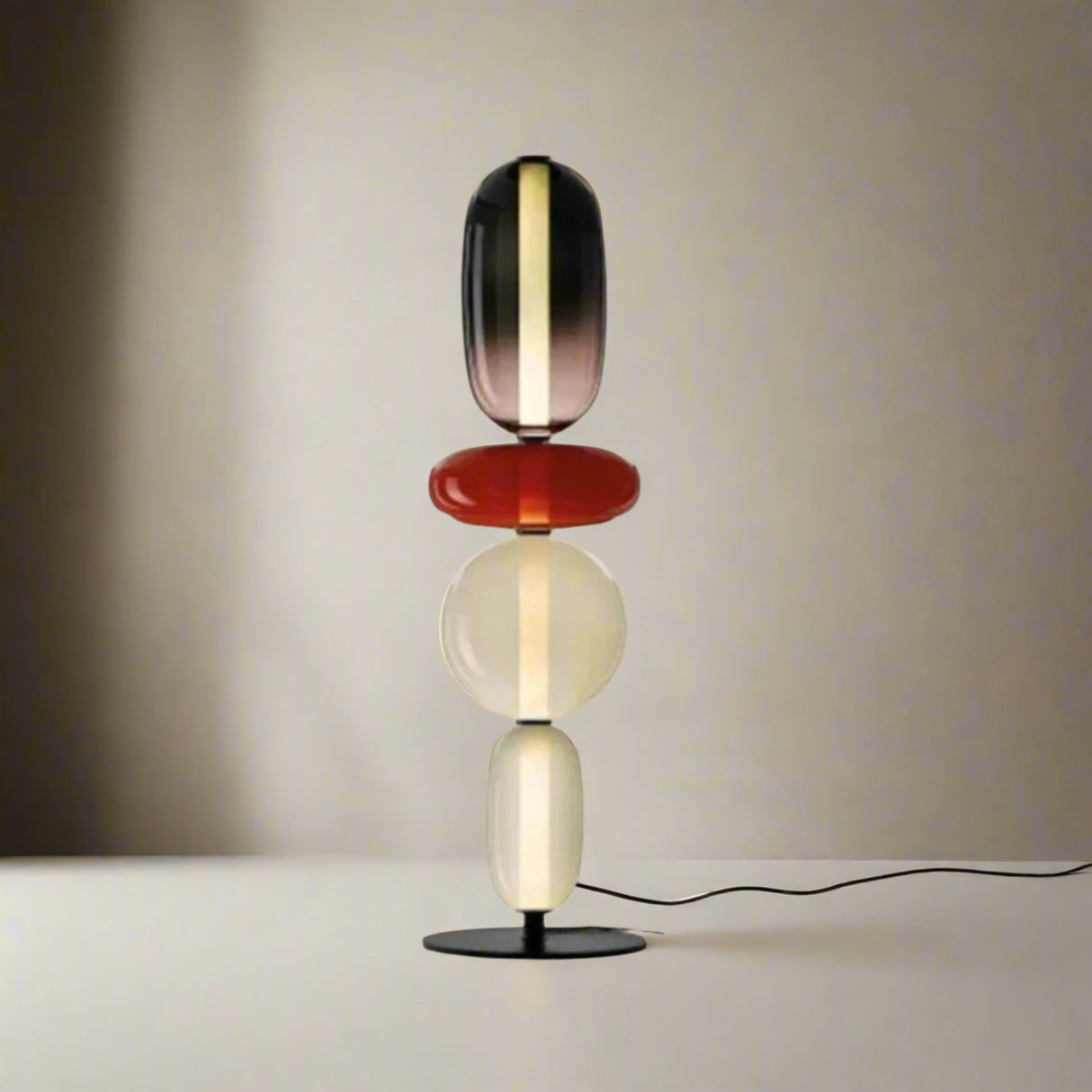 Table lamp with four colorful heads and dimensions on a white background