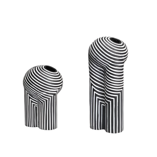 Two black and white striped vases on a white background