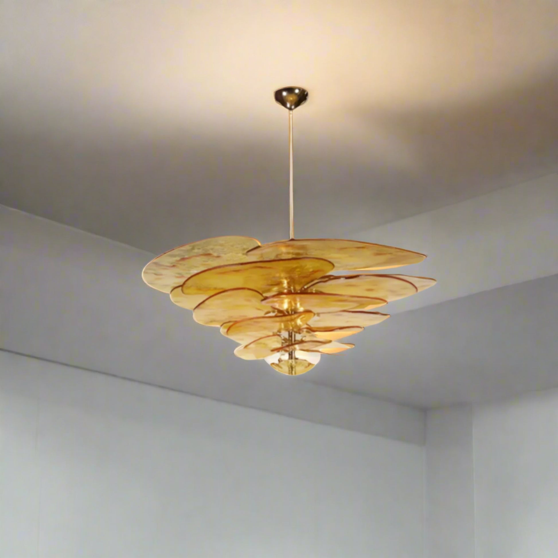 Amber-colored chandelier with dimensions and material details on a white background