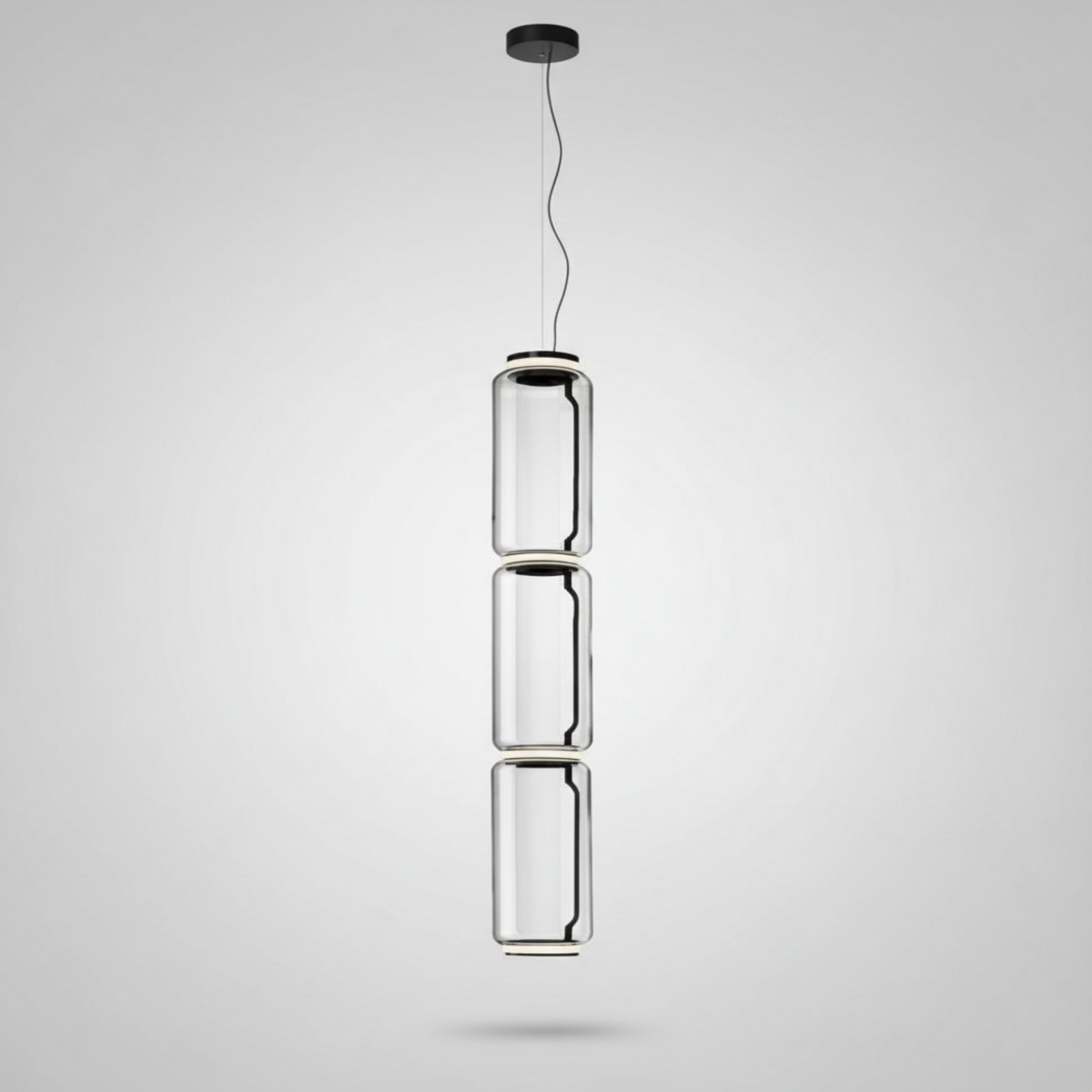 Modern pendant light with cylindrical design on a white background