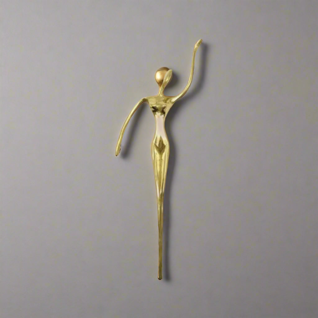 Gold decorative pull handle on a white background