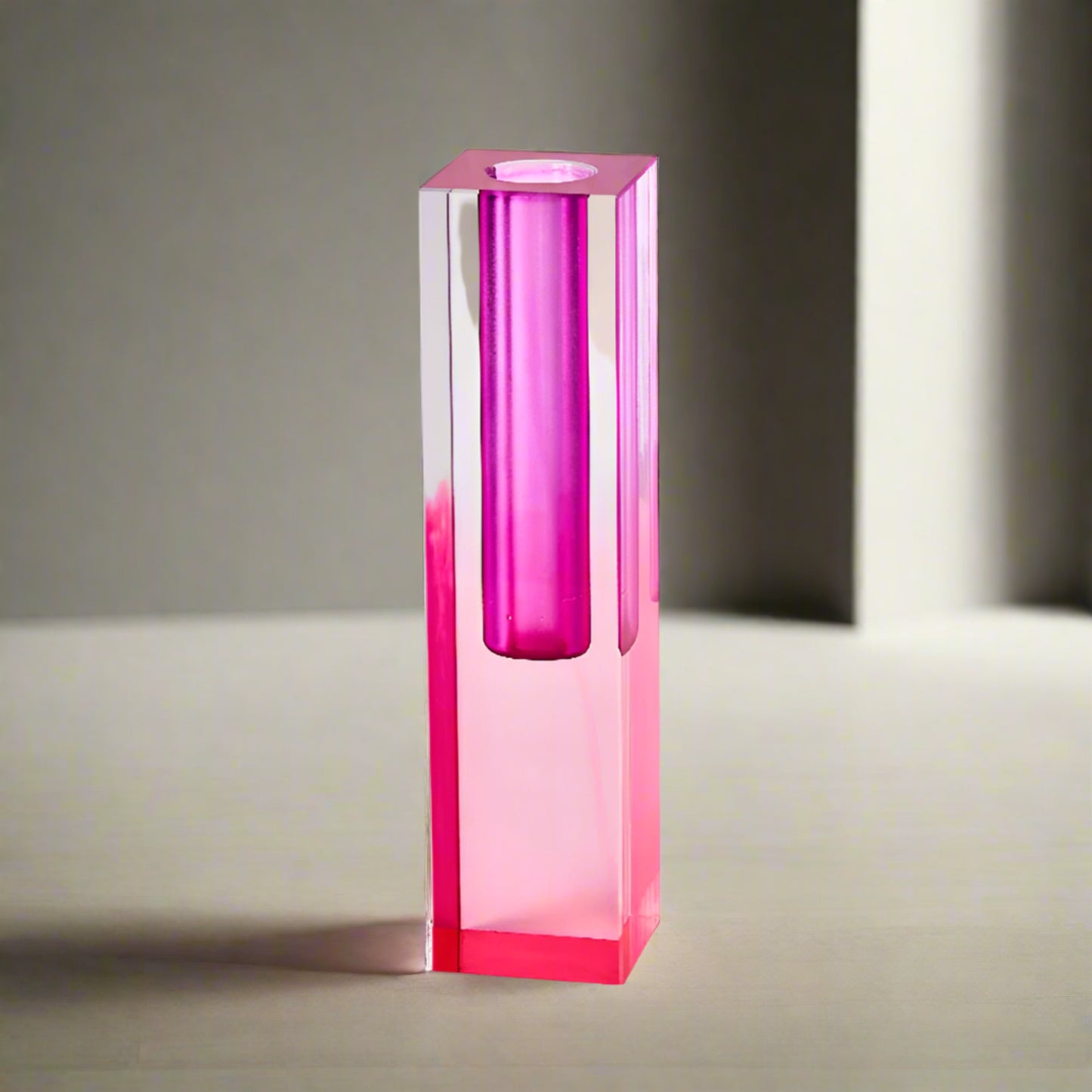 Pink glass vase on a white background