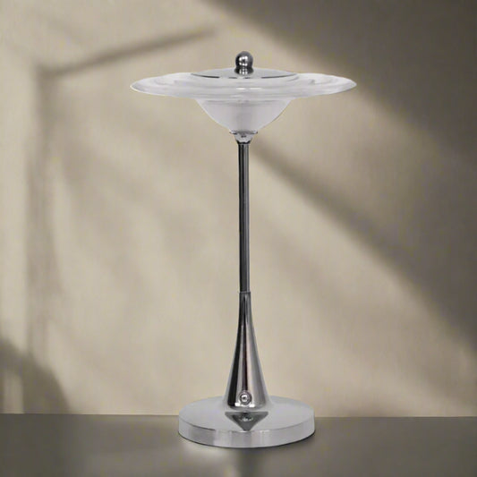 Chrome pedestal with a bowl-like top on a white background
