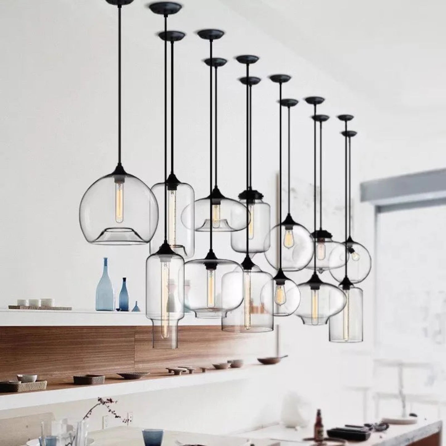Modern pendant lights with glass shades in a kitchen setting