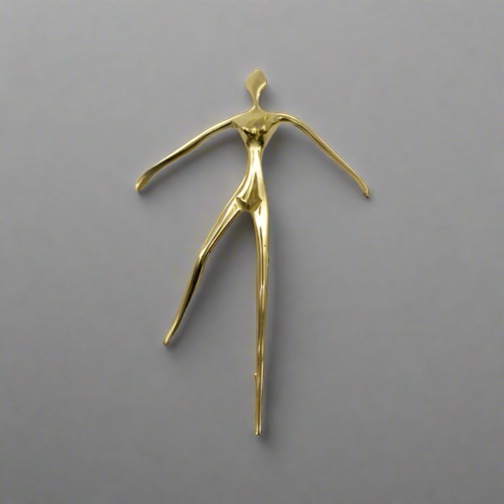 Gold cabinet handle sculpture of a dancer with dimensions on a white background