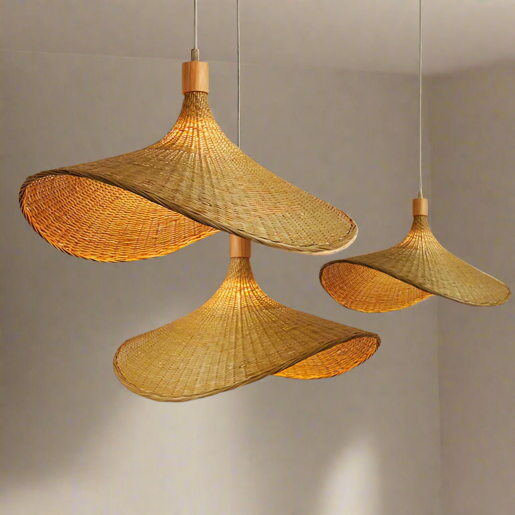 Woven pendant lights with a blurred green outdoor background