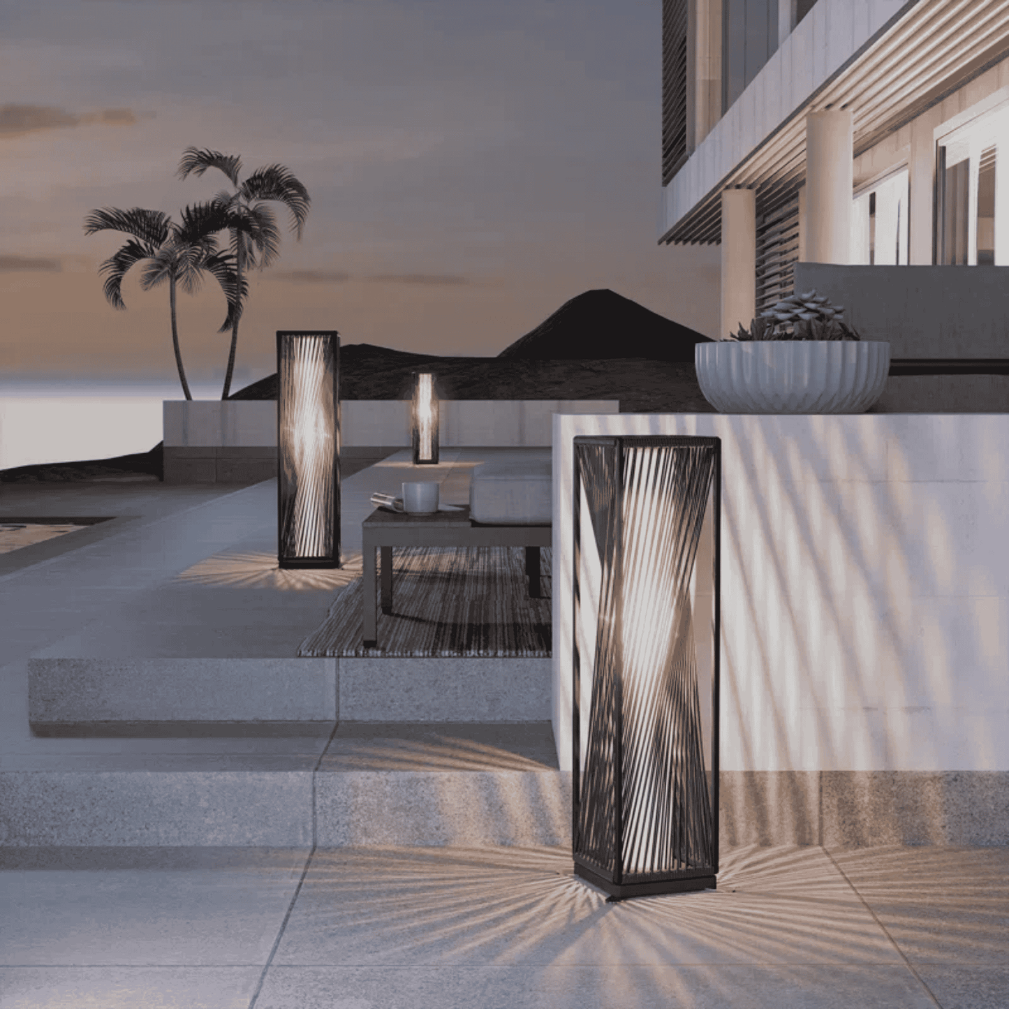 Modern outdoor setting with decorative lamps and a building in the background