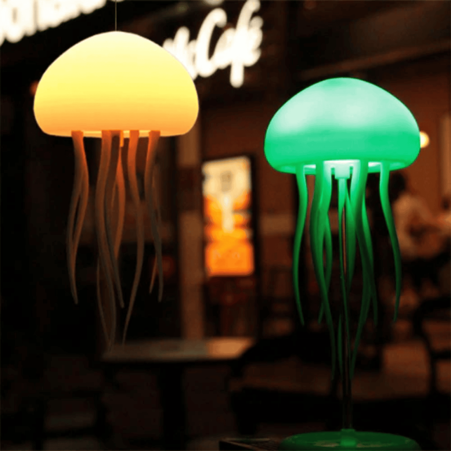 Two jellyfish-shaped lamps, one yellow and one green, in a blurred indoor setting.