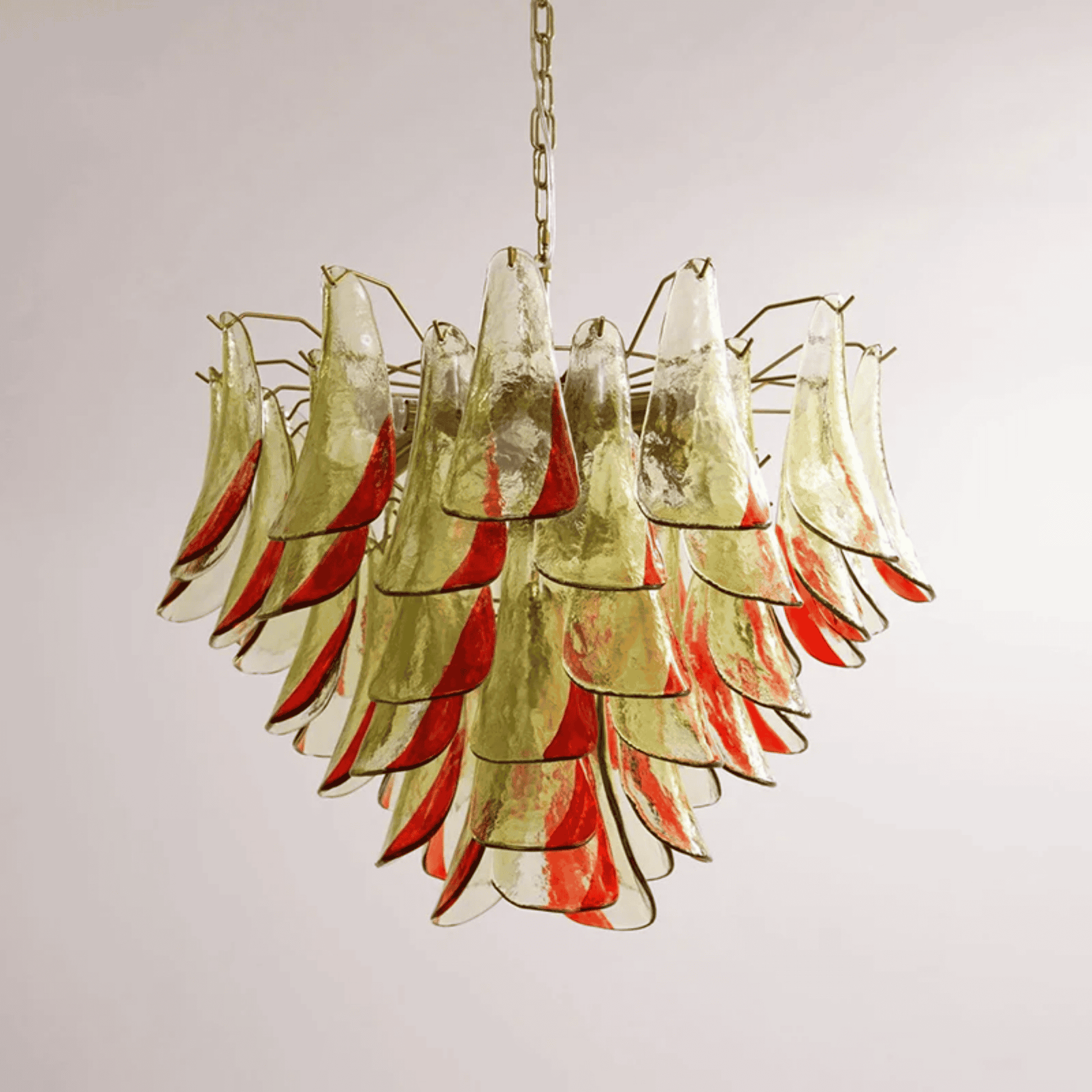Chandelier with red and gold glass shades on a plain background