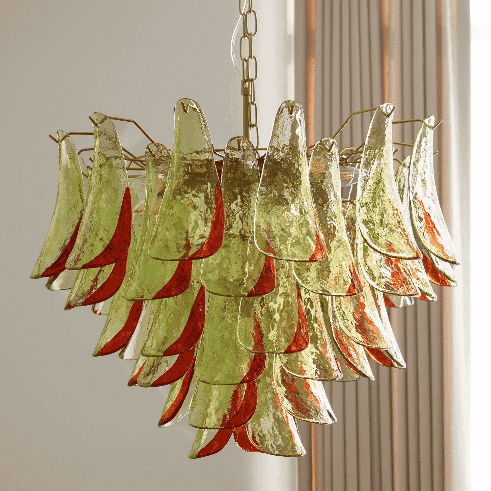 Chandelier with green and red glass panels on a neutral background