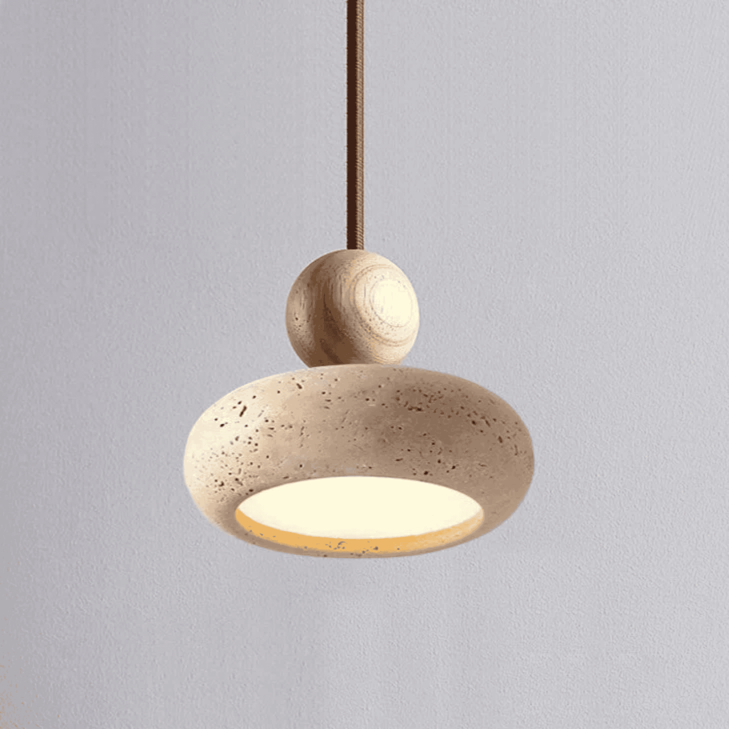 Beige pendant light with a textured design on a gray background