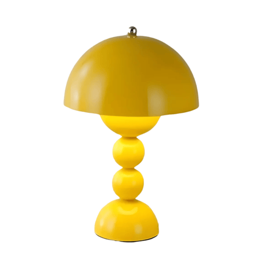 Yellow table lamp with a unique design on a white background