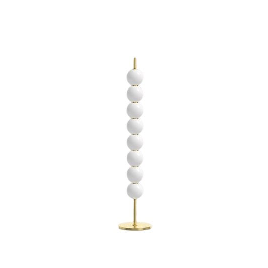 Decorative floor lamp with white spherical beads and gold base on a white background