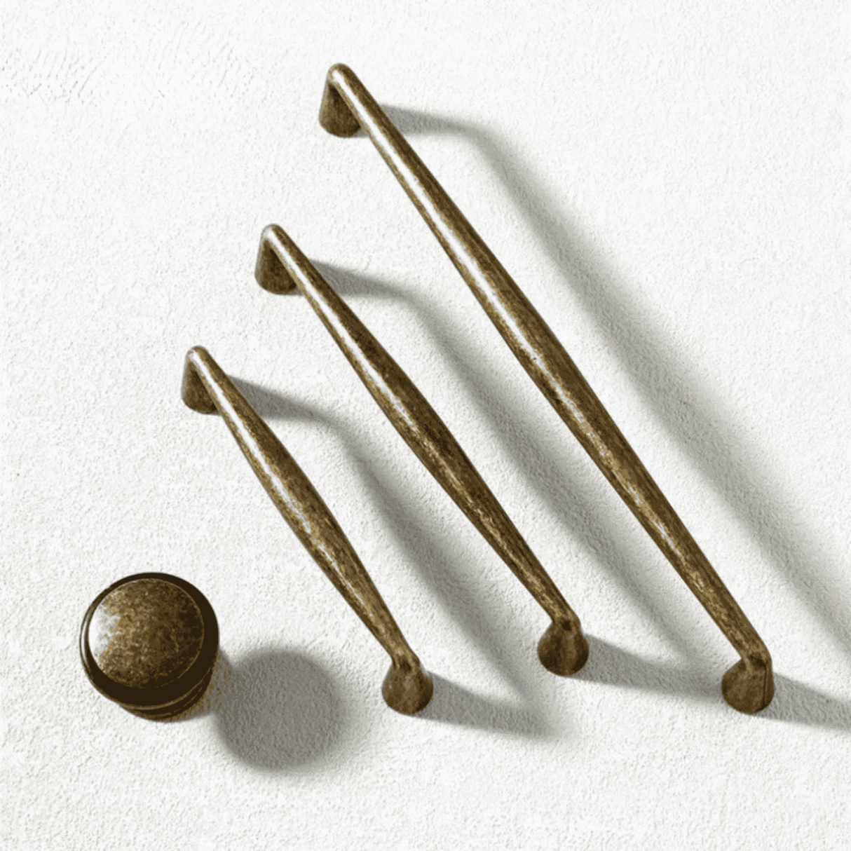 Set of bronze cabinet handles on a white background
