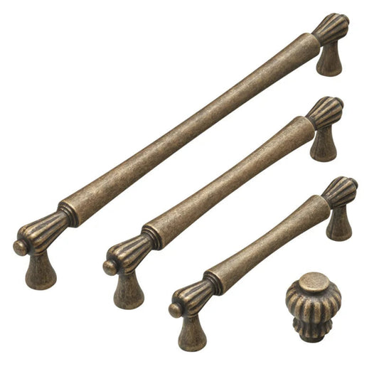 Set of bronze cabinet handles and knobs on a white background