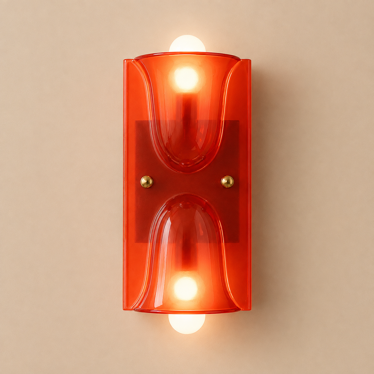 A modern wall-mounted light fixture with a translucent orange-red glass shade and two glowing warm white bulbs, centered against a plain beige wall.