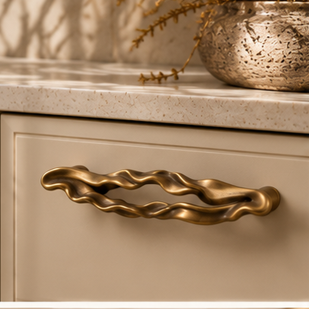 Ondara Wave Pull – Antique Bronze – Cream cabinet lifestyle