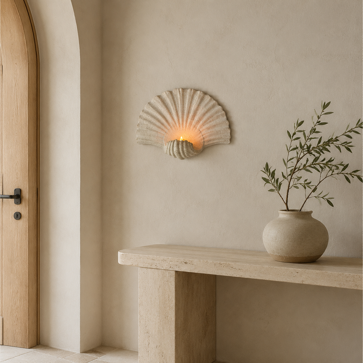 Shell-shaped wall candle holder in a warm Mediterranean entryway