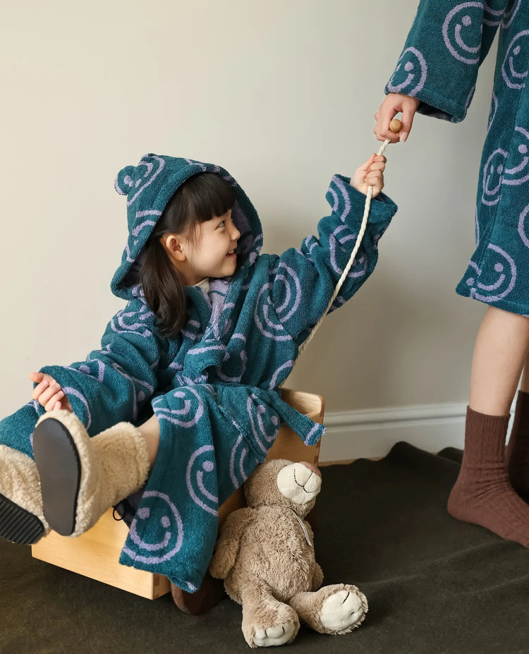 Kids in a smiley robe