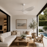 Modern living room with a sectional sofa, coffee table, and decorative elements.