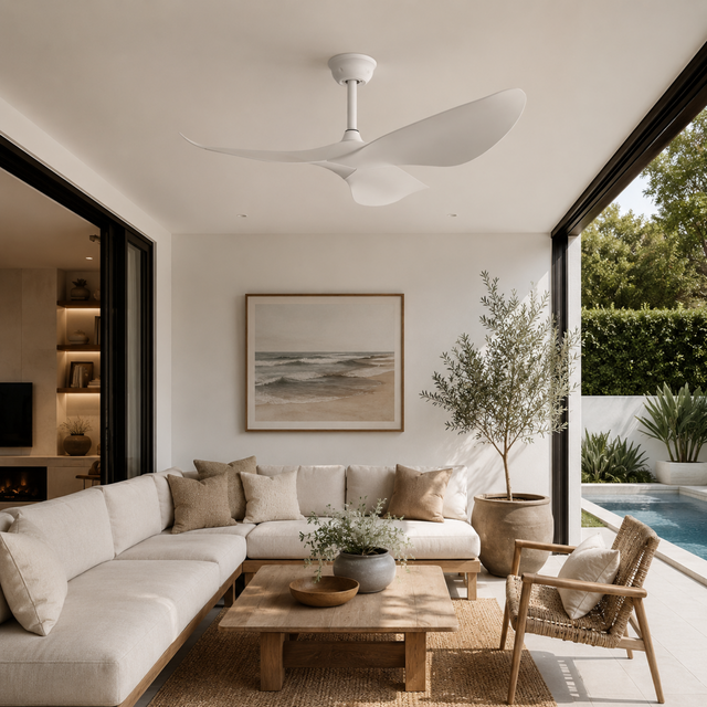 Modern living room with a sectional sofa, coffee table, and decorative elements.
