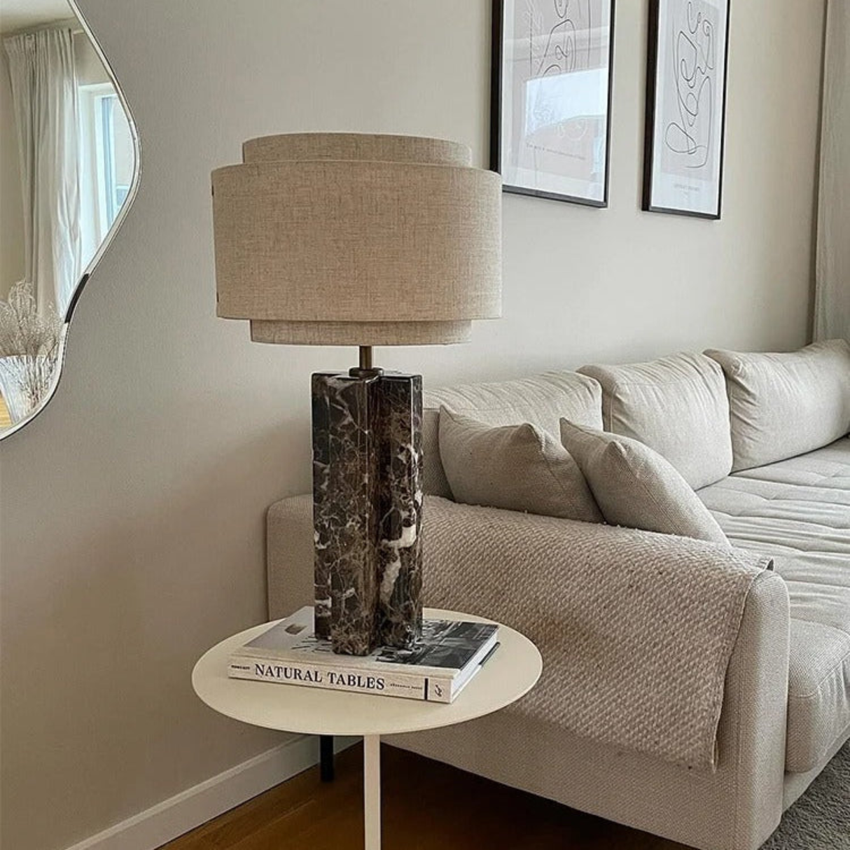 Living room with a lamp on a side table next to a sofa