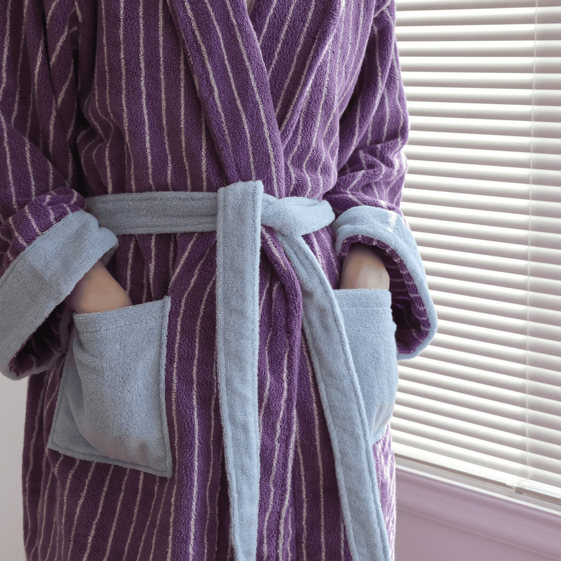 Purple and gray striped robe with a belt, close-up shot.