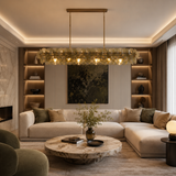 Modern living room with a chandelier, sofa, and coffee table.