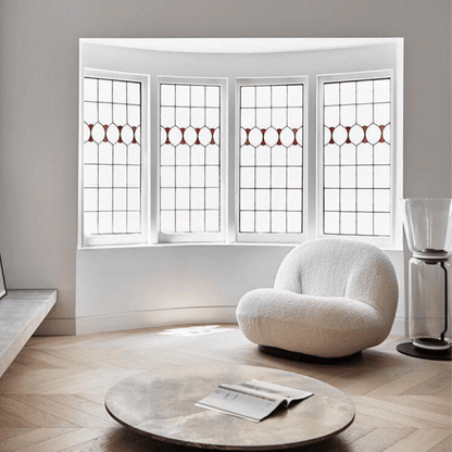 Modern living room with a textured white armchair and round wooden coffee table.