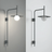 Modern wall-mounted light fixture on a neutral background