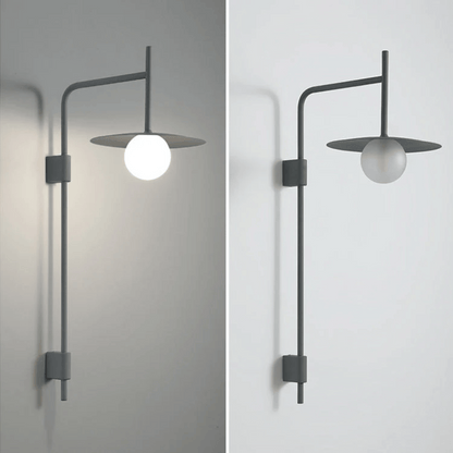 Modern wall-mounted light fixture on a neutral background