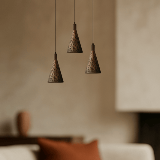 Elegant pendant light  that combines vintage walnut and copper finishes in living room.