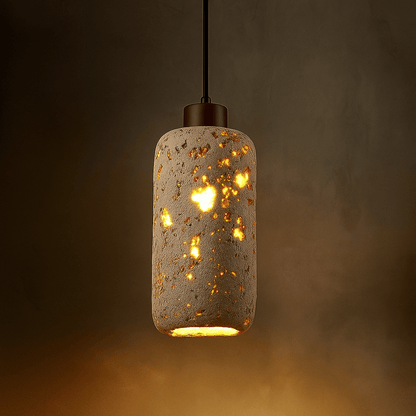 Decorative pendant light with a textured concrete-like finish on a dark background