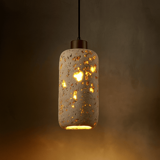 Decorative pendant light with a textured concrete-like finish on a dark background