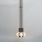 Modern pendant light with glass shades on a gray background