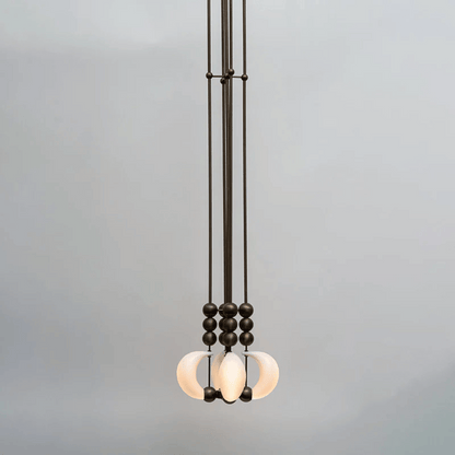 Modern pendant light with glass shades on a gray background