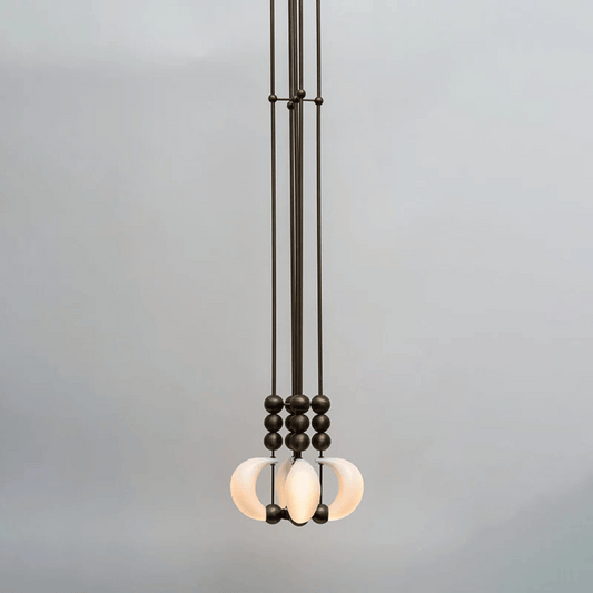 Modern pendant light with glass shades on a gray background