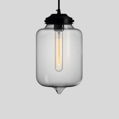 Clear glass pendant light with black fixture on a gray background