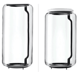 Two clear glass jars with black bases on a white background