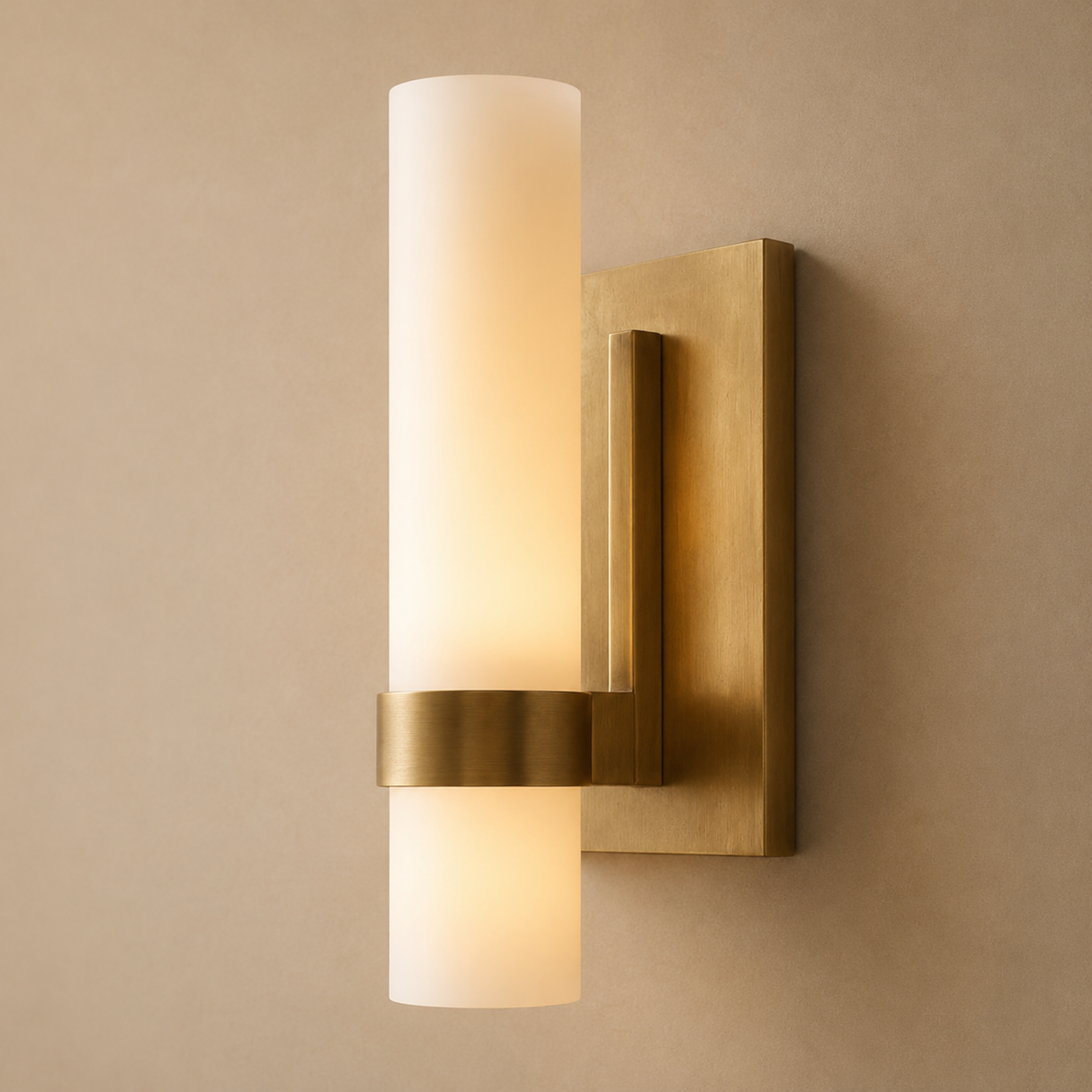 Gold wall sconce with two light fixtures on a beige wall.