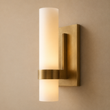 Gold wall sconce with two light fixtures on a beige wall.
