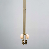 Modern pendant light with spherical design on a gray background