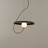 Black MagnoGlow Magnetic Pendant Light styled in a bedroom — minimalist interior by Baskoraa