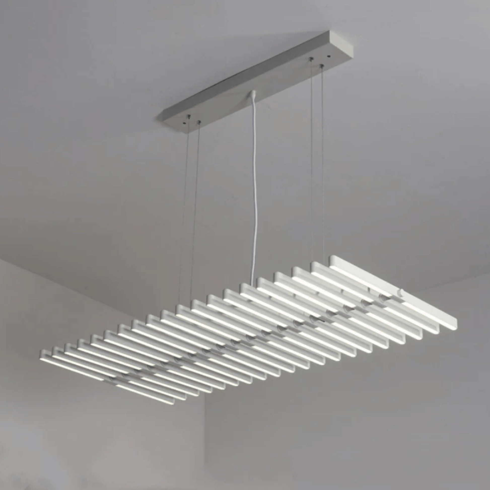 Modern pendant light fixture hanging from a ceiling