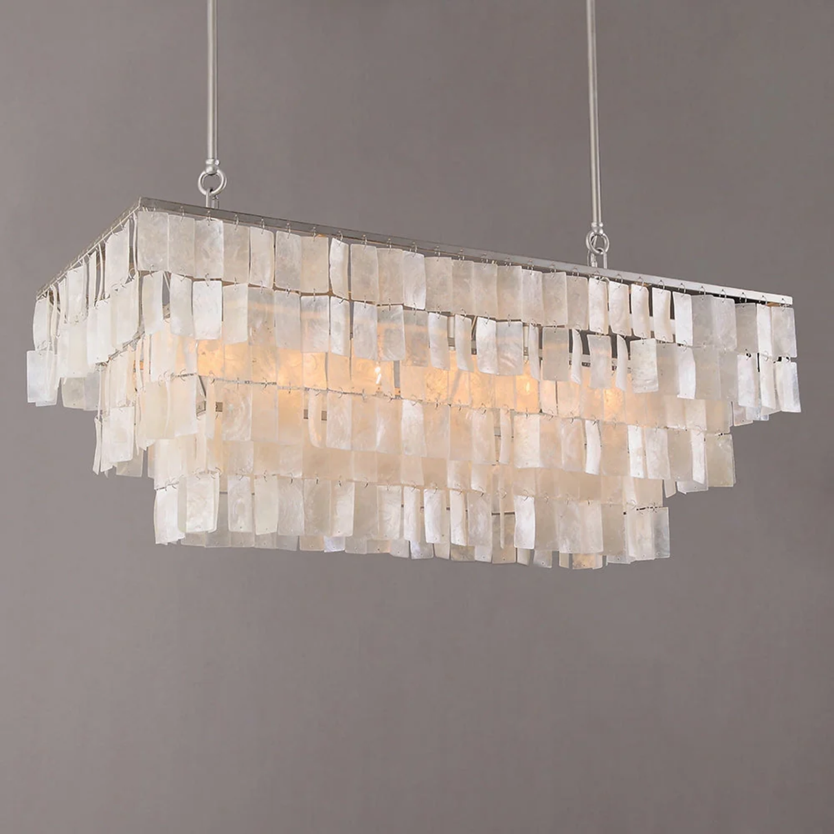 Rectangular chandelier with shell-like material on a gray background